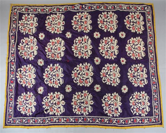 A large purple silk Suzani, c.1880, possibly from Tajikistan, 253cm x 198 cm